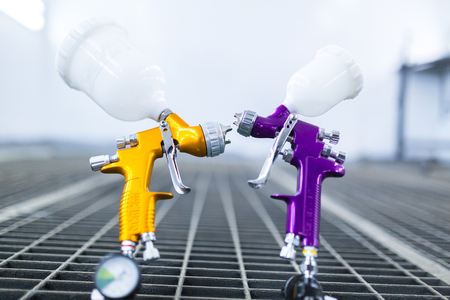 Two airbrush workshop in paint chamber bacgroundの写真素材