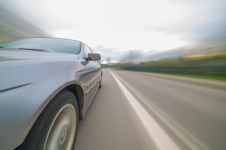 Front side view of black car with heavy blurred motion.の写真素材