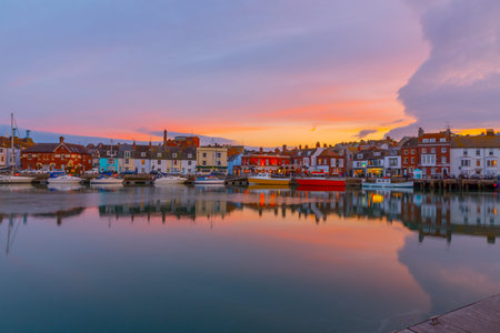 Fishing harbour at sunset in Weymouth, Dorset, UKの写真素材