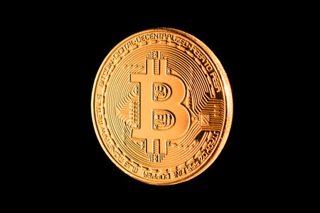 golden bitcoin criptocurrency isolated on black background