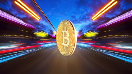 The physical coin is a gold bitcoin on a night road with speed traffic light trails abstract background. Concept Bitcion is speedy money.の写真素材