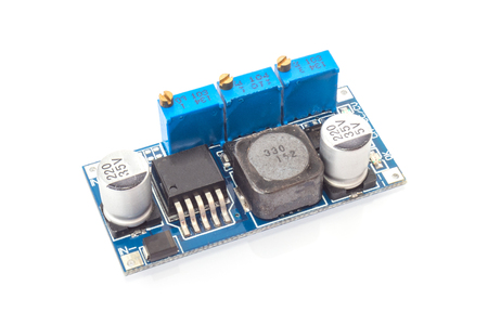 simple DC - DC converter board isolated on whiteの写真素材