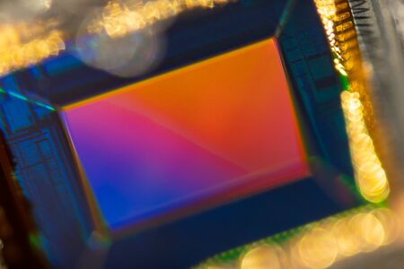 Small Digital smartphone camera CMOS Sensor macro shot with rainbow reflectionの写真素材