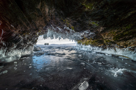 Ice cave on Olkhon island on Baikal lake in Siberia at winter time