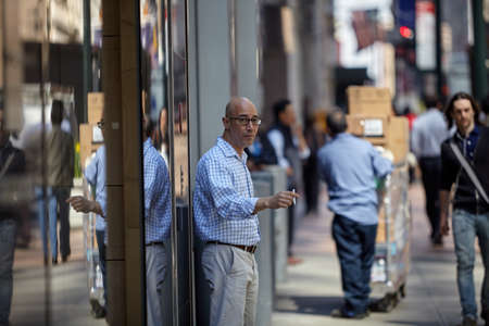 NEW YORK NY 22 April 2015 A man walking in midtown Manhattan.のeditorial素材