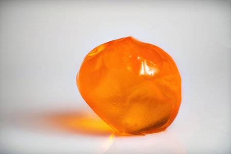 Several salmon caviar on white background. Macro picture.の写真素材