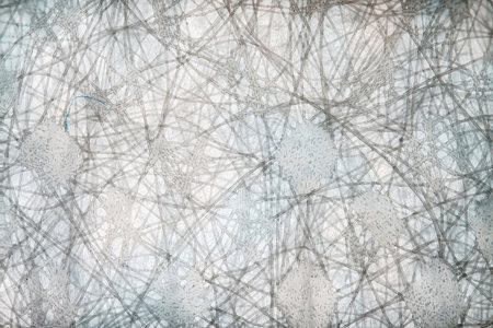 Macro close up of blue medical virus protection face mask selective focus on mask fabric and small...