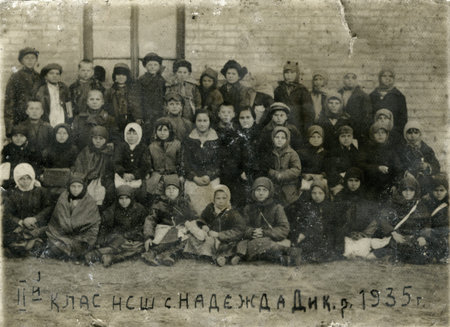 Poltava, Ukrrane, circa 1935: Group photo of the elementary school elementary school in the Soviet Union. Below the name of the village in Ukraine, Poltava region and the inscription Our classのeditorial素材
