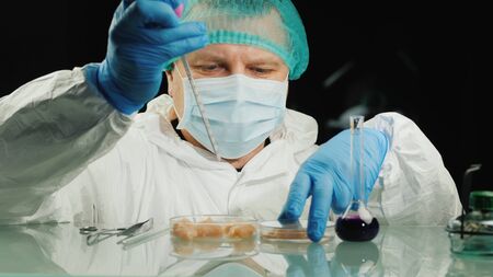 The lab technician checks the quality of the chicken meat in the lab. Food quality controlの写真素材