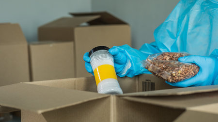 Volunteer prepares food kits from long-storage products