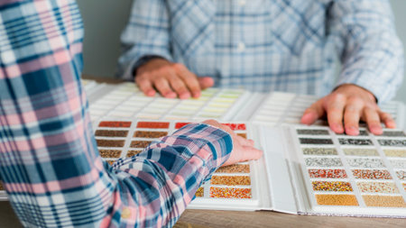 A group of designers are working on a color solution, using a catalogue of samples