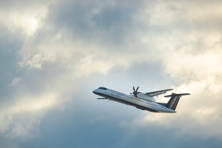 Toronto, Canada, 20 October 2025: Air Canada Express turboprop aircraft taking off above Toronto...