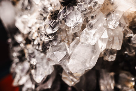 Macro shot of clear quartz crystals with sharp transparent points forming a natural mineral cluster backgroundの写真素材