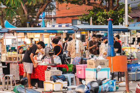 Ko Samui, Thailand, 7 March 2026: Busy street food market with local vendors and customers in Koh...