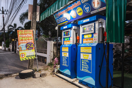 Ko Samui, Thailand, 20 March 2026:Self service petrol vending machines on roadside in tropical town