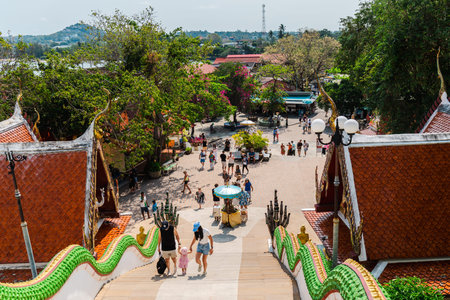 Ko Samui, Thailand, 22 March 2026: Tourists walking down stairs at Wat Phra Yai Big Buddha temple on...