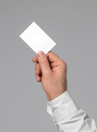 Holding blank business cardの写真素材