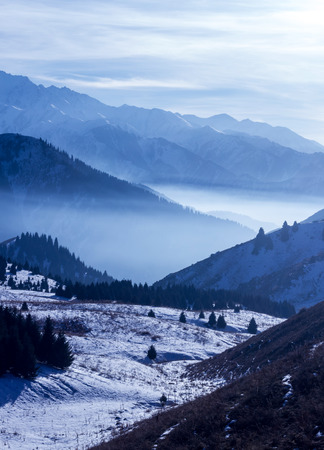 Foggy sunset in the Kazakhstan mountainsの写真素材