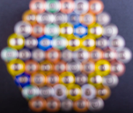 Battery AA texture blurred in a row. Defocused rows of batteries, top view. Multicolored batteries AA, cell row hexagon organizedの写真素材