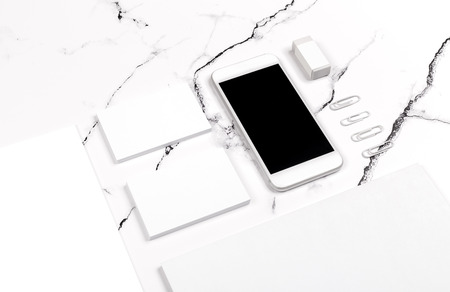 Photo of branding identity mock up on white marble. Template isolated on marble background. For graphic designers presentations and portfolios marble premium luxury mock-upの写真素材