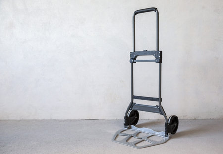 hand truck on the concrete floor in unfinished apartment.