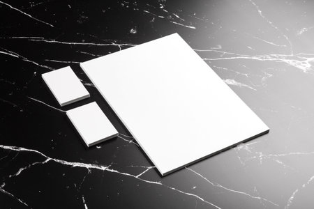 Photo of branding identity mock up on marble. Template isolated on marble background. For graphic...