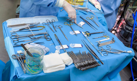 Surgical instruments in operating room on table.