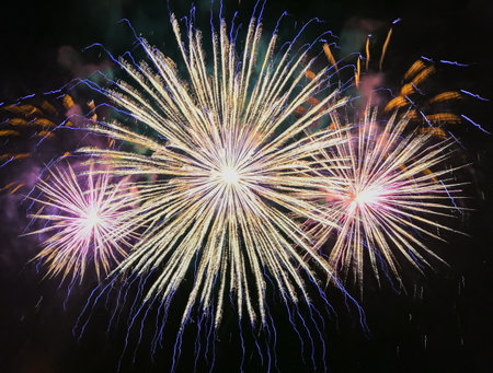 Colorful fireworks of different colors over the night sky during the holiday.の写真素材