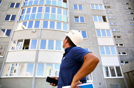 foreman, inspector examines the house for defectsの写真素材