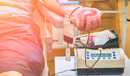 Donate blood with an inflatable ball in your hand.の写真素材