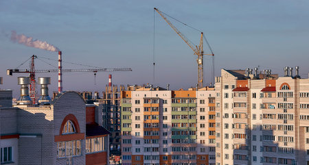 construction site and sunset in winter, structural steel beam builds large residential buildings on...