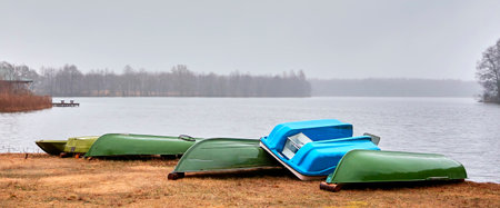 Old boats are overturned on the shore. Boat station.の写真素材