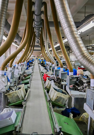 The process of making shoes in a factory. Workshop, assembly line in a shoe factory.の写真素材