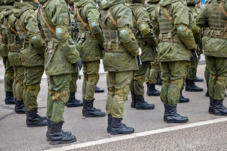 Army Soldiers In Uniform Standing In A Row On Parade Ground During Inspectionの写真素材