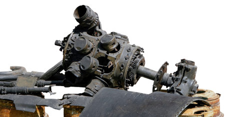 A close-up of a worn motorcycle engine shows the intricate mechanisms and rust, highlighting years...
