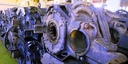 Detailed view of engine components arranged in a workshop, showcasing the complexity and intricacy...
