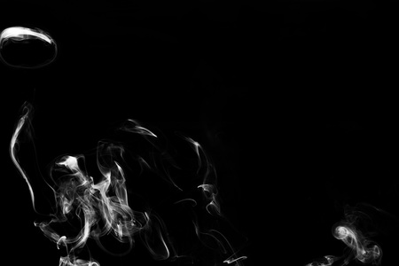 smoke on dark backgroundの写真素材