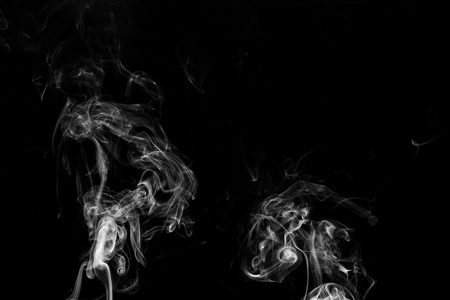 white smoke flame on a black backgroundの写真素材