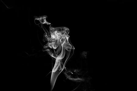 white smoke flame on a black backgroundの写真素材