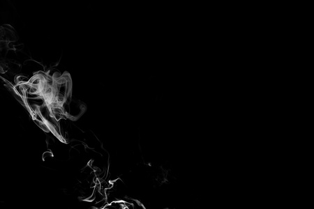 white smoke flame on a black backgroundの写真素材