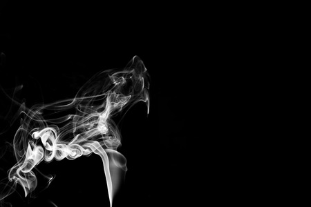 white smoke flame on a black backgroundの写真素材