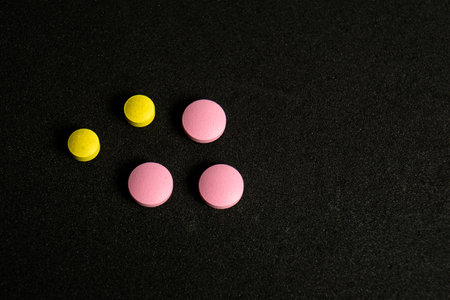 A bunch pills isolated on blackの写真素材
