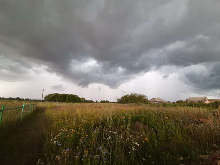 Farmland scenery storm. Wait for hurricane in the countrysideの写真素材