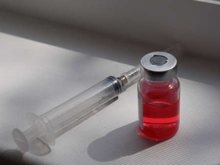 ampoule with a red medicineの写真素材