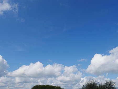 Clear blue sky and white cloudsの写真素材