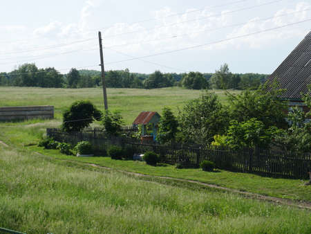 Rural landscape. Green grass and well. Summertime.の写真素材