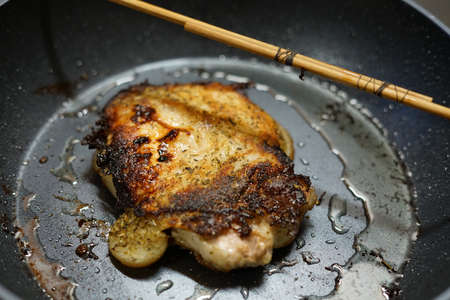 Pork fried in a frying pan. At home. The view from the top.の写真素材