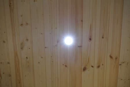 Daylight lamp built into the wooden ceiling. LED. Lightの写真素材