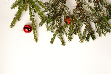 Spruce branch and Christmas toys on a white background. Isolateの写真素材