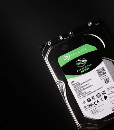 Moscow, Russia - march 3 2021: Branded hard drive for a personal computer on a black background. Storage for text and media files. Metalのeditorial素材